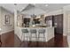 A bright and expansive kitchen with a large island, stainless steel appliances, and modern lighting fixtures at 5909 Oxford Moor Blvd, Windermere, FL 34786