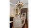 Well-lit kitchen showcasing a central island with modern appliances and stylish cabinetry with decorative lighting at 5909 Oxford Moor Blvd, Windermere, FL 34786