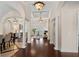 Spacious living room featuring a fireplace, views of the pool and dark hardwood floors at 5909 Oxford Moor Blvd, Windermere, FL 34786