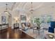 Bright living room boasting detailed ceiling, fireplace, and views of the backyard pool at 5909 Oxford Moor Blvd, Windermere, FL 34786