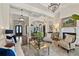 Elegant living room featuring dark wood floors, an ornate chandelier and a cozy fireplace at 5909 Oxford Moor Blvd, Windermere, FL 34786