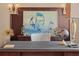 Close-up on a home office featuring elegant nautical themed decor, complementing the dark wooden desk and cabinetry at 5909 Oxford Moor Blvd, Windermere, FL 34786