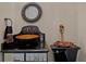 Unique powder room with a vessel sink atop a black vanity and decorative mirror and fixtures at 5909 Oxford Moor Blvd, Windermere, FL 34786