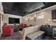 Home theater with star ceiling, large screen, projector, comfortable seating, and a wet bar for entertaining at 5909 Oxford Moor Blvd, Windermere, FL 34786