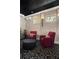 Inviting theater room boasts plush seating, tufted walls, patterned carpet, and recessed lighting for ambiance at 5909 Oxford Moor Blvd, Windermere, FL 34786