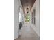 Covered walkway with stone floors, decorative iron railings, and elegant hanging lanterns at 5909 Oxford Moor Blvd, Windermere, FL 34786