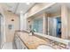 Bright bathroom with double sinks, granite countertops, and a glass-enclosed shower at 627 Darcey Dr, Winter Park, FL 32792