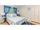 Comfortable bedroom with natural light, stylish blue curtains, and ample closet space at 627 Darcey Dr, Winter Park, FL 32792