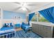 Bright bedroom with blue accents, twin beds, and a comfortable rug at 627 Darcey Dr, Winter Park, FL 32792
