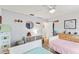 Well-lit bedroom with white furniture, twin beds, and comfortable décor at 627 Darcey Dr, Winter Park, FL 32792
