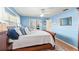 Comfortable bedroom with a sleigh bed, decorative pillows, and built-in bookshelf at 627 Darcey Dr, Winter Park, FL 32792