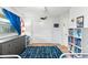 Well-lit bedroom with white walls, blue accents, a fun rug, and closet at 627 Darcey Dr, Winter Park, FL 32792