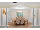 Elegant dining room with a chandelier, parquet floors, and views to the living room at 627 Darcey Dr, Winter Park, FL 32792