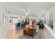 Open concept living space with a kitchen, dining area, and sunroom filled with natural light at 627 Darcey Dr, Winter Park, FL 32792