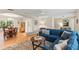 Spacious living room featuring hardwood floors and seamless connection to the dining area at 627 Darcey Dr, Winter Park, FL 32792