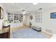 Open living room with built-in shelving, wood flooring, and ample lighting at 627 Darcey Dr, Winter Park, FL 32792