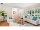 Inviting living room with comfortable seating, parquet floors, and bright natural light through shuttered windows at 627 Darcey Dr, Winter Park, FL 32792