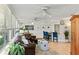 Open concept living space with a kitchen, dining area, and sunroom filled with natural light at 627 Darcey Dr, Winter Park, FL 32792