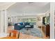 Bright and airy living room with hardwood floors, large windows, and stylish decor at 627 Darcey Dr, Winter Park, FL 32792
