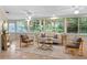 Bright and sunny sun room with tile floors and large windows providing natural light at 627 Darcey Dr, Winter Park, FL 32792