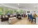 Bright sunroom with a dining and living area, offering views of the backyard at 627 Darcey Dr, Winter Park, FL 32792