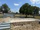 Landscaped backyard features a brick fire pit and outdoor lounge, perfect for entertaining at 6653 Se 87Th St, Ocala, FL 34472