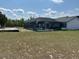 Large backyard features a screened-in pool and plenty of room to roam at 6653 Se 87Th St, Ocala, FL 34472