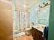 Bathroom with neutral tile flooring, blue walls and a shower curtain at 6653 Se 87Th St, Ocala, FL 34472