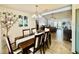 Open-concept dining area offers pool view, stylish lighting, and seamless living at 6653 Se 87Th St, Ocala, FL 34472