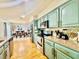 Modern kitchen featuring updated appliances, stylish cabinetry and laminate floors at 6653 Se 87Th St, Ocala, FL 34472