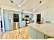 Bright kitchen with stainless steel appliances, modern cabinetry, and breakfast bar at 6653 Se 87Th St, Ocala, FL 34472