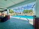 Relaxing enclosed pool with an outdoor seating area and plenty of space to swim at 6653 Se 87Th St, Ocala, FL 34472