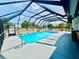 Relaxing enclosed pool boasts plenty of room to swim and an outdoor seating area at 6653 Se 87Th St, Ocala, FL 34472