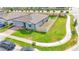 Overhead view of the property showcasing its fenced yard, landscaping, and corner lot location at 719 Tortugas St, Haines City, FL 33844
