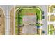Aerial view of roofs, driveways, and lawns; cars parked along streets at 719 Tortugas St, Haines City, FL 33844