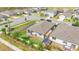 Aerial view of a home's well-maintained backyard with white fencing and a storage shed at 719 Tortugas St, Haines City, FL 33844