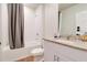 Clean bathroom features a shower-tub combination, neutral-toned vanity, and tile flooring at 719 Tortugas St, Haines City, FL 33844