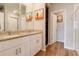 Bright bathroom with double vanity, granite countertop, white cabinets, and a large shower at 719 Tortugas St, Haines City, FL 33844