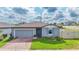 Charming single-story home with a well-manicured lawn and a cozy front entrance at 719 Tortugas St, Haines City, FL 33844