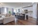 Open floor plan showcasing a modern kitchen, dining area and a cozy living room with a large sectional at 719 Tortugas St, Haines City, FL 33844