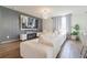 Bright living room features a large sectional sofa, custom accent wall and an electric fireplace at 719 Tortugas St, Haines City, FL 33844