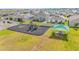 An aerial view of a sunny community playground with play equipment and a picnic shelter at 719 Tortugas St, Haines City, FL 33844