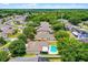 Aerial backyard view of home featuring in-ground pool and patio with partial fence at 7288 Winding Lake Cir, Oviedo, FL 32765