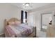 Inviting bedroom with queen bed, neutral walls, and ample natural light at 7288 Winding Lake Cir, Oviedo, FL 32765