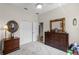 This bedroom features neutral carpet, a ceiling fan, and plenty of closet space at 7288 Winding Lake Cir, Oviedo, FL 32765