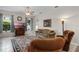 Comfortable living room with neutral colors and decorative lighting and curtains at 7288 Winding Lake Cir, Oviedo, FL 32765