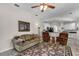 Inviting living room featuring stylish furnishings and open access to the kitchen at 7288 Winding Lake Cir, Oviedo, FL 32765