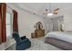 Spacious primary bedroom with carpeted floor, tray ceiling, and large window at 7288 Winding Lake Cir, Oviedo, FL 32765