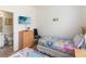 Bright bedroom with twin beds, plush bedding and modern decor at 7663 Fitzclarence St, Kissimmee, FL 34747