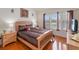Bedroom with wood flooring, natural light and modern decor at 7663 Fitzclarence St, Kissimmee, FL 34747